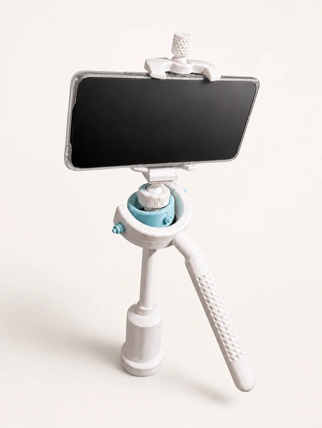 Stabilisateur vidéo blanc et bleu clair imprimé en 3D avec smartphone installé